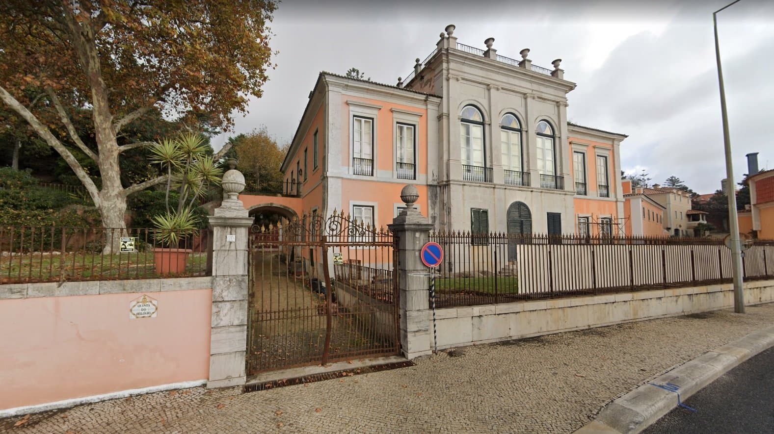 Neoclassical Palace With Clock Tower And Gardens Overlooking The Sea